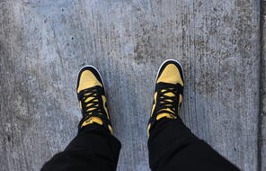 Black and yellow Nike sneakers 