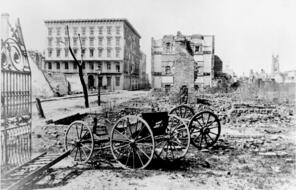 Ruins of a building and carriages.  