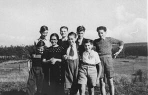 A group of Jewish children pose outside in the town of Le Chambon