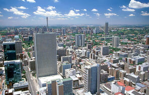 Birds eye view of Johannesburg with many tall modern buildings.