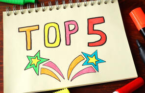 "TOP 5" written on a notebook
