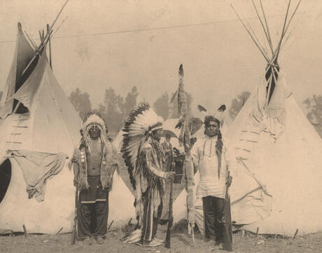 Three members of the Sioux tribe pose in Indian Village, 1898.