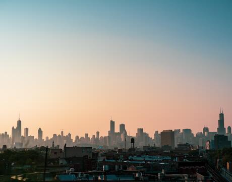 A silhouette of the Chicago City Skyline at sunrise.